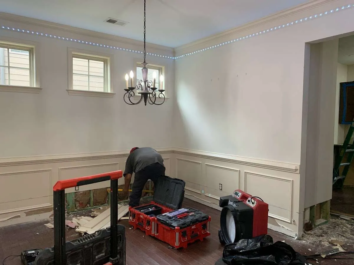 Restoration technician with professional equipment in Mashpee